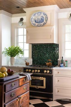 a black and white checkered floor in a kitchen with an old fashioned stove top oven