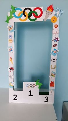 an olympic themed photo frame with the numbers 1, 2, 3 and 4 on it