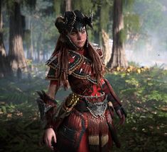 a woman dressed in costume standing in the woods