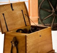 an open wooden box sitting on top of a table