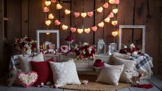 valentine's day decorations with hearts and flowers on the table