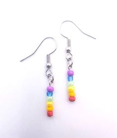 Rainbow Bead Pride Earrings Every pair is custom made upon request with irregular beads and no two pieces will be exactly the same, even in the same pair. Custom requests for any flag wanted are gladly accepted anytime! ️️ Colorful Hypoallergenic Dangle Jewelry, Colorful Nickel-free Dangle Beaded Earrings, Nickel-free Colorful Dangle Beaded Earrings, Nickel-free Rainbow Round Beaded Earrings, Rainbow Earrings With Colorful Beads, Rainbow Beaded Earrings With Ear Wire, Multicolor Czech Glass Beaded Earrings For Pierced Ears, Multicolor Czech Glass Beaded Earrings, Nickel Free Rainbow Beaded Earrings For Gifts