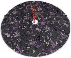 a clock that is on the side of a wall with purple and black cats all over it