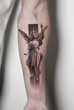 an angel tattoo on the left arm and leg, with a cross in the background