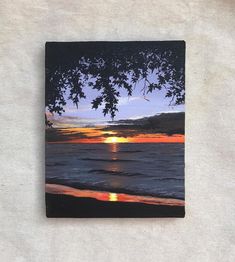 a painting of the sun setting over water with trees in it's foreground