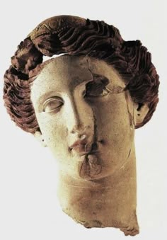 an ancient statue with hair blowing in the wind and eyes closed, head tilted to the side