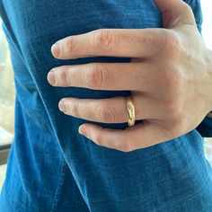 a man wearing a gold wedding band