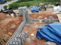 a construction site with concrete blocks laid out on the ground