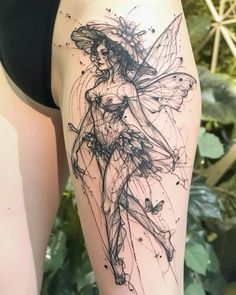 a woman's leg with a tattoo on it and a drawing of a fairy