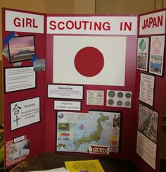 a display board with information about girl scouts in japan on the front and behind it