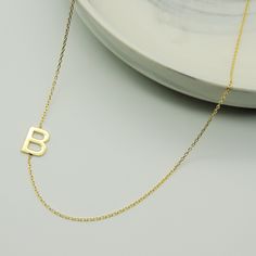 14K GOLD PERSONALIZED INITIAL NECKLACE * Material: 14k Solid Gold - 8k Solid Gold * Finish: White Gold - Yellow Gold - Rose Gold * Production Method : Laser and handmade processes * Lenght: Adjustable Between 14 inch - 20 inch * Letter Height: 1 cm A Necklace that your neck will seriously loveee. This name necklace is perfect for everyday. * 100% Handmade for your size * All jewelry comes in beautiful packaging, gift ready. * All items are made to order in Turkey. * Our current processing times 14k Gold Initial Pendant Necklace With Hallmarks, Minimalist Yellow Gold Name Necklace For Birthday, Dainty Initial Necklace In Yellow Gold For Birthday, Classic Yellow Gold Name Necklace For Birthday Gift, Gold Sterling Silver Initial Necklace For Birthday, Gold Initial Pendant Necklace With Hallmark, Hallmarked Yellow Gold Name Necklace For Birthday, Classic Yellow Gold Necklaces With Hallmarks, Classic Hallmarked Necklace For Birthday