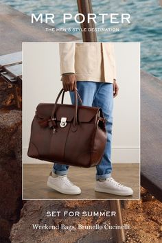 Brunello Cucinelli's weekend bag is built to last. It's been crafted in Solomeo, Italy from leather that'll achieve its own unique patina with time and fastens with a silver-tone lock. The fully lined interior has enough space for a spare pair of shoes, a change of clothes and your wash bag. Luxury Rectangular Weekender Bag For Workwear, Timeless Cognac Bag For Business Trips, Luxury Leather Duffle Bag For Work, Travel Bags In Cognac With Palladium Hardware, Designer Travel Briefcase With Smooth Grain, Travel Satchel In Cognac With Palladium Hardware, Luxury Workwear Duffle Bag, Classic Italian-made Satchel Bag, Solomeo Italy