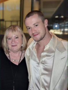 a man and woman standing next to each other