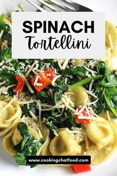 spinach tortellini with red peppers and parmesan cheese in a white bowl