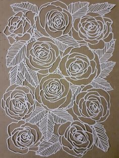 paper cut out with flowers and leaves on the side, ready to be made into an art project