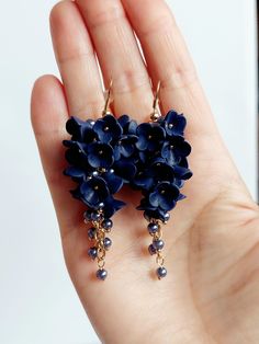 https://purplebeestudio.etsy.com Handmade polymer clay very delicate chandelier earrings. These elegant earrings in trendy  royal blue colour will become your favorits for many occasions day or night.  Perfect gift for a special woman in your life. Earrings made with brass ear wire. The earrings are very light and comfortable to wear all day. SHIPPING: Your order will be dispatched in a securely packed cardboard box. Product care:  - To ensure the product quality and durablility, avoid contact with water, lotion, perfumes and household cleaners and chemicals. - You can clean the products with a slightly damp soft fabric.  - Sharp objects can damage the clay surface. - When not in use, store in a dry, seperate box. Thank you for visiting my shop! If you have any special requests, I'll be ha Blue Dangle Flower Earrings In Polymer Clay, Elegant Blue Polymer Clay Earrings, Elegant Purple Polymer Clay Earrings, Delicate Chandelier, Royal Blue Colour, Birthday Presents For Her, Long Flowers, Handmade Jewelry Tutorials, Homemade Jewelry