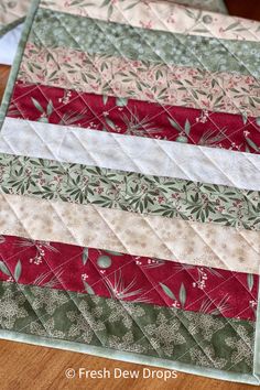 a close up of a quilted table runner