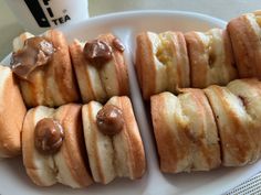 a white plate topped with cookies covered in chocolate