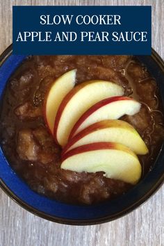 slow cooker apple and pear sauce in a blue bowl with text overlay that reads, slow cooker apple and pear sauce