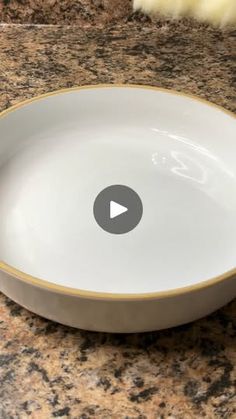 a white bowl sitting on top of a counter