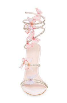 Floral-embellished rhinestone straps heighten the modern glamour of a sandal featuring a wraparound ankle strap and stiletto heel. 4 1/4" heel Synthetic upper, lining and sole Imported Asian Owned/Founded Bedazzled Heels, Whimsical Heels, Cute Hoco Heels, Pink Heels Outfit Dresses, Luxury Spring Heels For Prom, Ethereal High Heels, Statement Heels, Pink Heels With Flowers, White Heels Pink Flowers