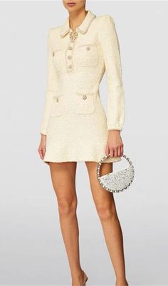 Sparkle and shine in our EMBELLISHED SEQUINED BOUCLÉ-KNIT MINI DRESS, designed to add a touch of glamour and opulence to any occasion! Crafted from a luxurious bouclé-knit fabric and embellished with shimmering sequins, this dress is sure to turn heads. Further enhanced by the flattering mini length, it'll be sure to make you stand out in style. Gentle Dry Clean OnlyColour may vary due to lighting on images. The product images (without model) are closest to the true colour of the product.Item ru Luxury Spring Tweed Party Dress, Chic Embellished Fitted Tweed Dress, Embellished Tweed Evening Dress, Embellished Tweed Dress For Party, Chic Tweed Dress With Sequins For Parties, Chic Party Tweed Dress With Sequins, Elegant Embellished Fitted Tweed Dress, Elegant Fitted Embellished Tweed Dress, Embellished Fitted Mini Dress For Fall