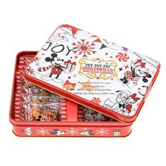 an open tin box filled with candy and candies