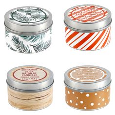 four tins with different types of candles in them