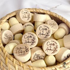 several wooden wine corks in a basket with names on them and date written on them