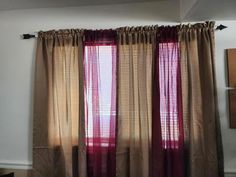 the curtains are hanging on the wall in the room