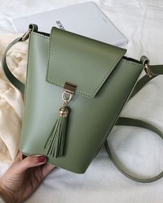 Green Vertical Shoulder Handbag For Women. This green vertical shoulder handbag is made of durable materials. This green vertical shoulder handbag is perfect for evening, night out and everyday wear. The handbag size is 4.7'' x 8.2'' (12 cm x 21 cm). The thickness is 3.9'' (10 cm). Security Badge, Small Leather Bag, Feminine Women, Handbag For Women, Cute Handbags, Beautiful Handbags, Sandals Brands, Shoulder Handbag, Sneaker Brands