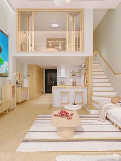 a living room filled with furniture next to a stair case in a home on top of a hard wood floor