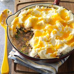 a casserole dish with mashed potatoes and meat