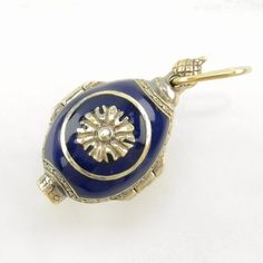 This egg-shaped locket has a blue enamel and gold hue color scheme, with a floral design. It opens to reveal religious and royal figures and a small diamond! This pendant weighs 11.5 Grams Its dimensions are 1 1/8" tall (not including bale) x 5/8" wide The Loop/Bail will fit a chain up to 5.3 mm wide The pendant features Enamel, Locket, Diamond Figures, Gold Hue, Egg Stone/Design The Color of this pendant or design is Blue Stone or Design measurements are: 1.6 mm Markings: China, 925-FM, (Tested Oval Enamel Locket Jewelry, Blue Enamel Locket Jewelry, Ornate Oval Enamel Jewelry, Blue Engraved Jewelry For Ceremonial Occasion, Ceremonial Blue Engraved Jewelry, Ceremonial Blue Enamel Jewelry, Antique Blue Jewelry For Ceremonial Occasions, Antique Blue Locket Jewelry, Antique Blue Oval Pendant Jewelry