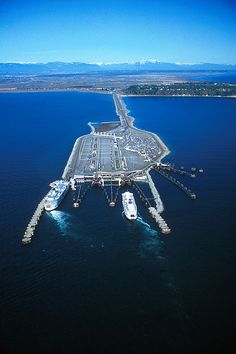 an aerial view of a harbor with boats in the water