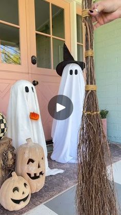 halloween decorations on the front porch with ghost and jack - o'- lanternes