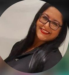 a woman wearing glasses and smiling in front of a white circle with an image of her