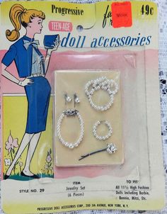 two pairs of beaded earrings and a pin with an advertise for doll accessories