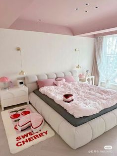 a large bed sitting in the middle of a bedroom