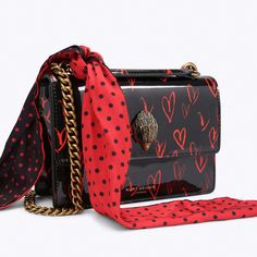 The Small Shoreditch Cross Body is crafted from leather that features a red heart print that has been hand designed in house. The front flap is topped with antiqued brass Eagle head with crystals and black crystal eyes.5.3in (H), 7.8in (L), 2.3in (D)Strap drop: 50inAntiqued brass chain strap fed through two metal bridgesRed and black polkadot removable scarfDuo magnetic snap closure hidden under flapGold foil embossed logo on the frontExterior flat pocket on the backCan fit phones up to 7 inches Crystal Eyes, Cute Outfits With Jeans, Handbag Essentials, Girly Bags, Red Scarf, Luxury Purses, Girly Accessories, Eagle Head, Bag Icon