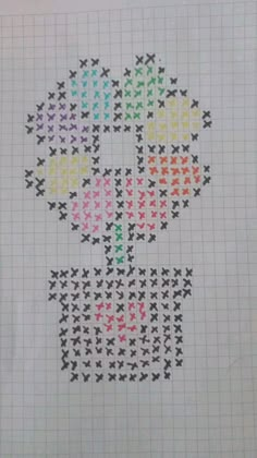 a cross - stitch pattern with flowers and hearts on the bottom, in different colors