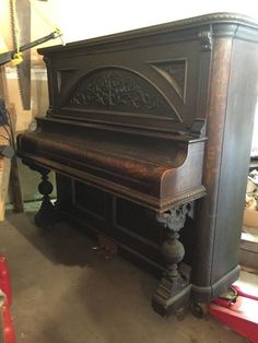 an old piano is being worked on in a shop