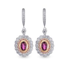 Breathtakingly beautiful...Oval Ruby and Fancy Pink Diamond drop halo earrings mounted in 18K white and rose gold. The oval Rubies are of a beautiful lively red color . The inner halo of the earrings are set with Fancy Pink round brilliants weighing 0.12Ct TW, mounted in rose gold. The outer halo, mid-section and hangers are set with collection colorless round brilliants weighing 0.84Ct TW. Overall a truly exquisite pair of earrings.  The appearance of the final product may vary slightly fro... Ruby Jewellery, Extraordinary Jewelry, Plain Wedding Band, Dazzling Earrings, Pink Round, Halo Earrings, Pink Bling, Jewellery Earrings, Mom Jewelry