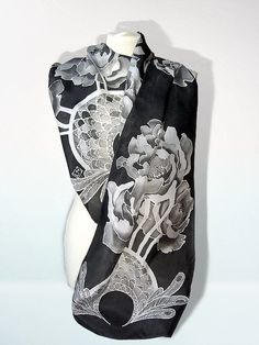 Black scarves 'Peony' is a hand painted silk scarf decorated with black and white flowers. This black and white foulard will make a wonderful gift for someone very special. Peony silk scarf is hand painted by me. It's design was inspired by a Art-Nouveau style of drawing flowers and baroque ornaments. This black silk scarf is a one of a kind wearable piece of art. It will go stunningly with a black dress or any other smart outfit. This foulard is decorated with 11 big peonies and two complimenta Black Silk Scarves As A Gift, Artistic Black Silk Scarves, Black Artistic Silk Scarf, Artistic Black Silk Scarf, Flowers Peony, Design Art Nouveau, Black Silk Scarf, Baroque Ornament, Black And White Scarf