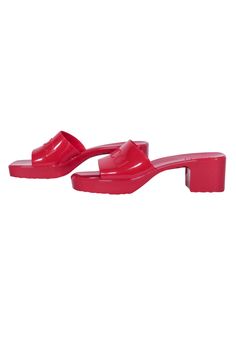 Create sizzling summer looks with these red-hot rubber sandals from Gucci. Playfully chic, these square-toe slide sandals are boosted by a waved platform and chunky heel. A wide, glossy band with raised logo lettering adds a touch of quiet luxury to these must-have shoes. Perfect for pool parties and warm-weather adventures! Size 10 (EU 40) Rubber Slip-on Logo strap Block heel Square toe Heel height 2.25" Platform height .75" Red Gucci Sandals For The Beach, Trendy Block Heel Slides For Summer, Trendy Sandals With Block Heel And Red Sole, Trendy Summer Slides With Open Heel, Trendy Synthetic Summer Clogs, Trendy Summer Clogs For Party, Trendy Summer Synthetic Clogs, Trendy Summer Party Clogs, Summer Synthetic Slides With Block Heel