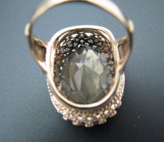 "Pre-owned Pre-Owned: This Item is in good condition, it shows some light wear/aging, AS SEEN IN PICTURES Metal: Yellow Gold Metal Purity: 14k Ring Size: 6.5 For Sale: (1) Stunning Oval Cut Smokey Quartz in a 14k Yellow Gold Elegant Ring PLEASE READ ENTIRE DESCRIPTION BEFORE PURCHASING Please see pictures for more details! This is a lovely large oval cut smokey quartz ring in 14k yellow gold simple elegant mounting. The inside of the ring is not stamped but has been tested to 14k gold. There app Estate Oval Jewelry For Wedding, Antique Oval Diamond Ring For Formal Occasions, Estate Style Oval Jewelry For Anniversary, Estate Oval Diamond Ring For Formal Occasions, Estate Oval Rings For Formal Occasions, Estate Style Oval Diamond Ring For Formal Occasions, Estate Style Oval Rings For Formal Occasions, Formal Oval Estate Rings, Estate Style 14k Gold Oval Jewelry