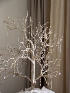 a white tree sitting on top of a table