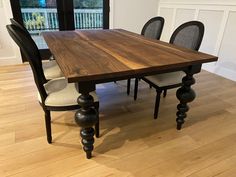 a wooden table sitting in the middle of a room