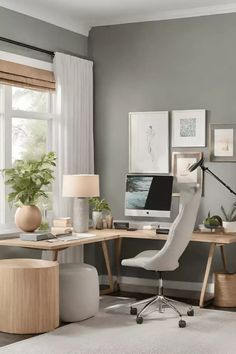 a home office with gray walls and white carpeted flooring, along with a desk that has a computer on it