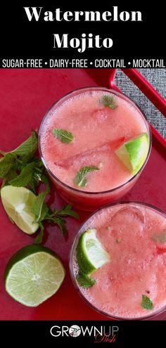 two glasses filled with watermelon mojito on top of a red tray